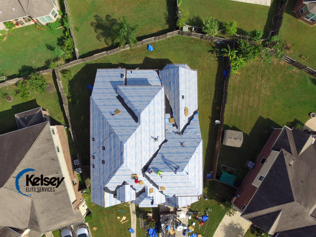 Roof replacement in progress in Sugar Land, TX showing damaged shingles removed and underlayment with ice & water shield installed.